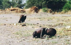 March 1993, Sudan --- Vulture Watching Starving Child --- Image by © Kevin Carter/Sygma/Corbis